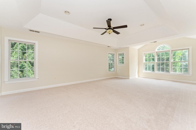 7412 Kallenburg Ct, Manassas, VA 20111 - empty room with ceiling fan, a raised ceiling, light carpet, and healthy amount of natural light
