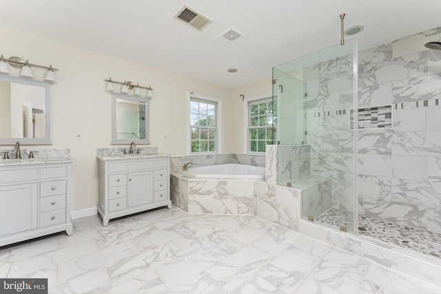 7412 Kallenburg Ct, Manassas, VA 20111 - full bathroom with a bath, a marble finish shower, two vanities, and marble finish floors