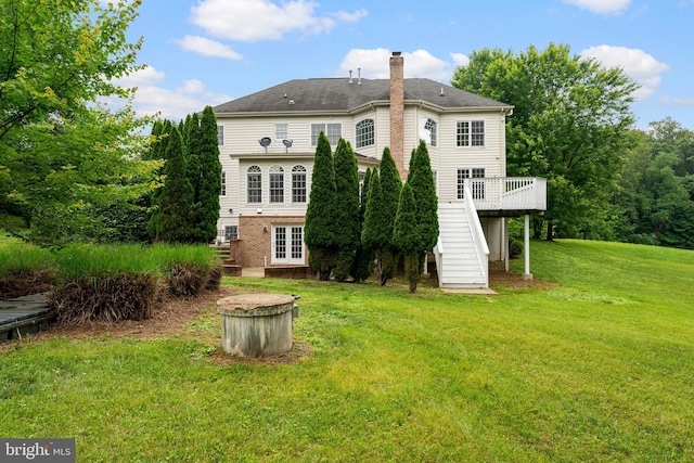 7412 Kallenburg Ct, Manassas, VA 20111 - rear view of property with stairway, a deck, a lawn, a chimney, and french doors