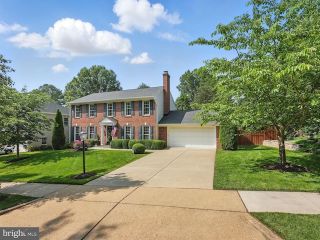 6134 Long Meadow Rd, Mclean, VA 22101 - view of front facade with a garage, driveway, brick siding, and a chimney
