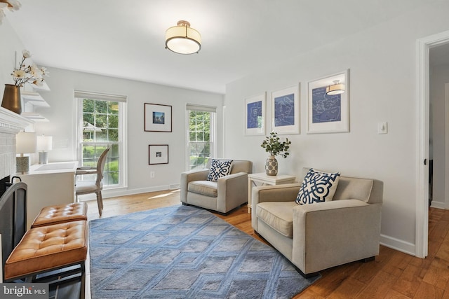 6134 Long Meadow Rd, Mclean, VA 22101 - living room featuring healthy amount of natural light, wood finished floors, and a fireplace
