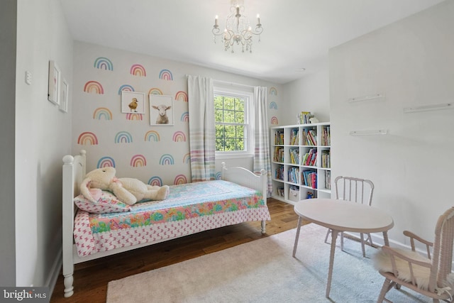 6134 Long Meadow Rd, Mclean, VA 22101 - bedroom with wood finished floors and a chandelier