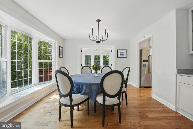 6134 Long Meadow Rd, Mclean, VA 22101 - dining room featuring a chandelier and light wood finished floors