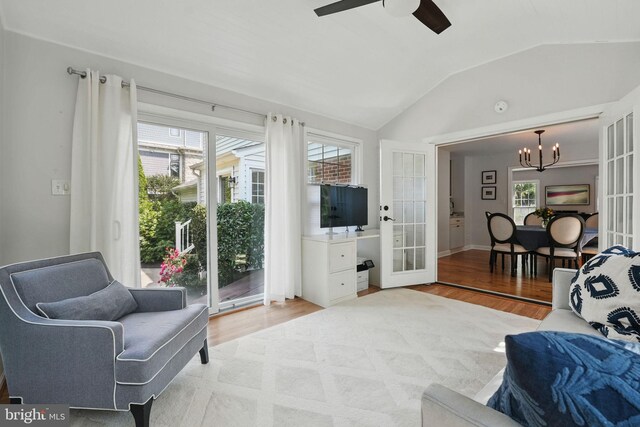 6134 Long Meadow Rd, Mclean, VA 22101 - living room with light wood-type flooring, a chandelier, healthy amount of natural light, vaulted ceiling, and french doors