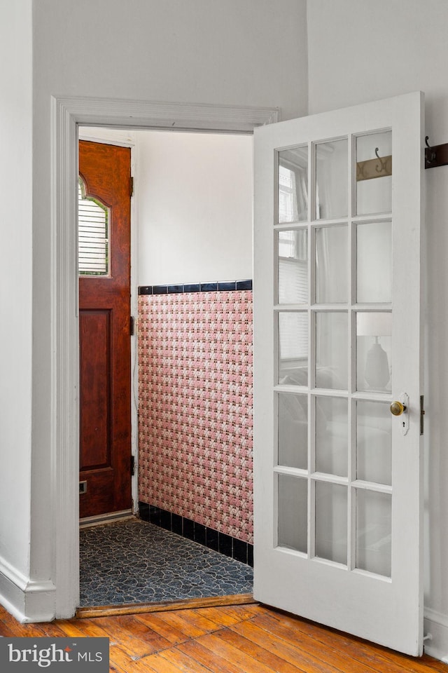 828 Mercer St, Philadelphia, PA 19125 - entryway featuring hardwood / wood-style floors, tile walls, and wainscoting