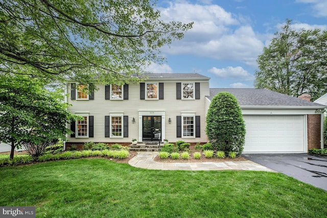 1109 Pipestem Pl, Potomac, MD 20854 - colonial home with asphalt driveway, a front lawn, and a garage