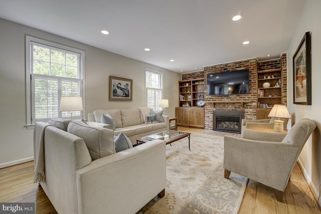 1109 Pipestem Pl, Potomac, MD 20854 - living area featuring recessed lighting, light wood finished floors, a fireplace, and built in features