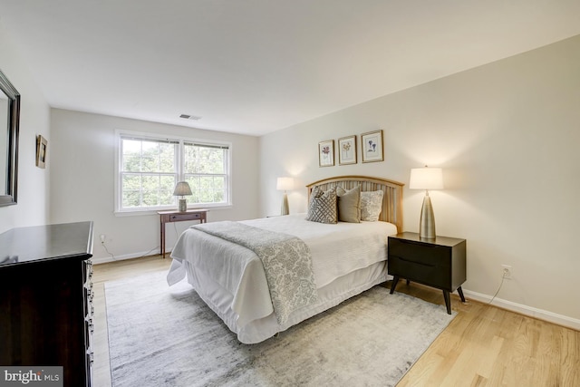 1109 Pipestem Pl, Potomac, MD 20854 - bedroom featuring light wood-type flooring and baseboards