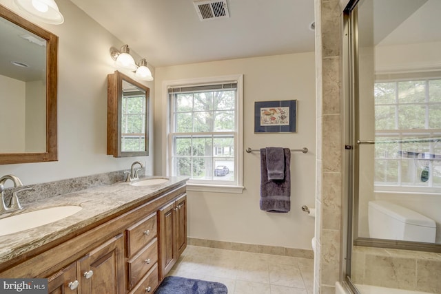 1109 Pipestem Pl, Potomac, MD 20854 - full bath with double vanity, tile patterned flooring, and an enclosed shower