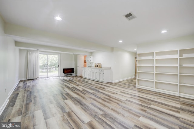 1109 Pipestem Pl, Potomac, MD 20854 - unfurnished living room featuring recessed lighting and light wood-style floors