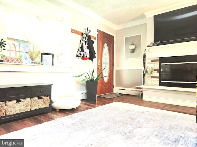 116 Hedding Rd, Bordentown, NJ 08505 - living area with ornamental molding, baseboard heating, wood finished floors, and a textured ceiling