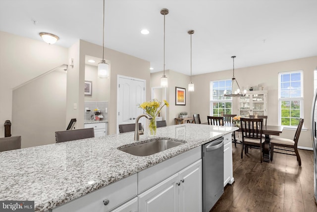 7802 Richard Halley Way, Elkridge, MD 21075 - kitchen featuring stainless steel dishwasher, dark wood-style flooring, light stone countertops, white cabinets, and hanging light fixtures