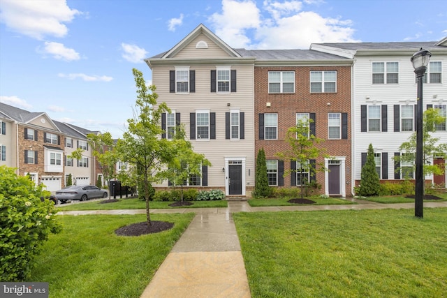 7802 Richard Halley Way, Elkridge, MD 21075 - townhome / multi-family property featuring a front yard and brick siding