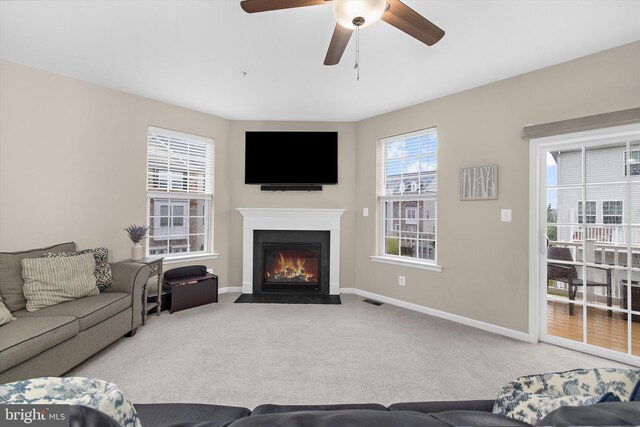 7802 Richard Halley Way, Elkridge, MD 21075 - living room with carpet flooring, ceiling fan, and a fireplace with flush hearth