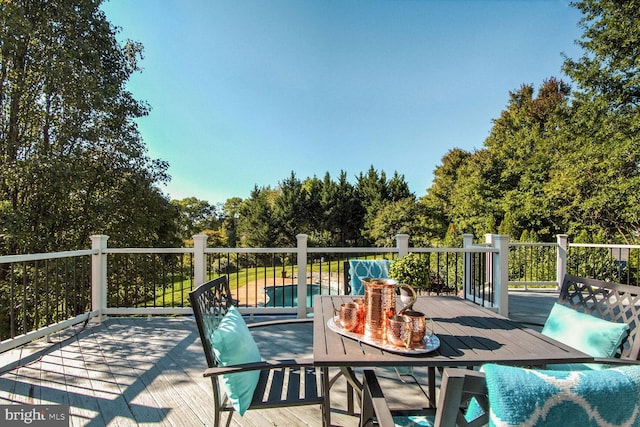 14401 Chalfont Dr, Haymarket, VA 20169 - wooden deck featuring outdoor dining space and view of scattered trees