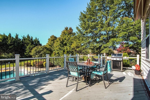 14401 Chalfont Dr, Haymarket, VA 20169 - wooden deck with a grill and outdoor dining space