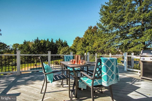 14401 Chalfont Dr, Haymarket, VA 20169 - deck featuring outdoor dining space and view of wooded area