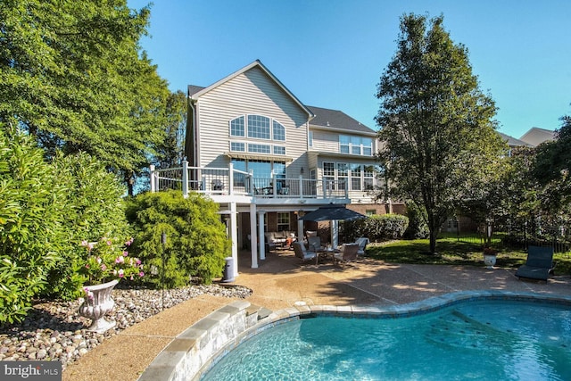 14401 Chalfont Dr, Haymarket, VA 20169 - back of house with a patio area and an outdoor pool