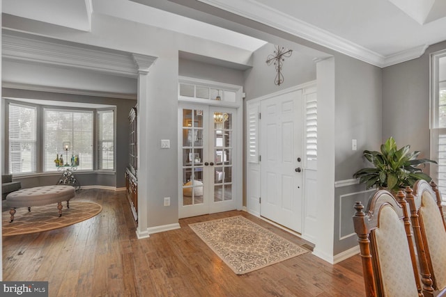 14401 Chalfont Dr, Haymarket, VA 20169 - foyer featuring wood-type flooring, plenty of natural light, ornamental molding, and french doors