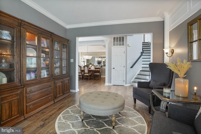 14401 Chalfont Dr, Haymarket, VA 20169 - sitting room with stairs, wood finished floors, and crown molding