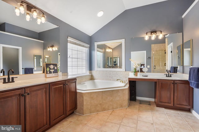14401 Chalfont Dr, Haymarket, VA 20169 - bathroom featuring vaulted ceiling, tile patterned floors, two vanities, a bath, and a stall shower