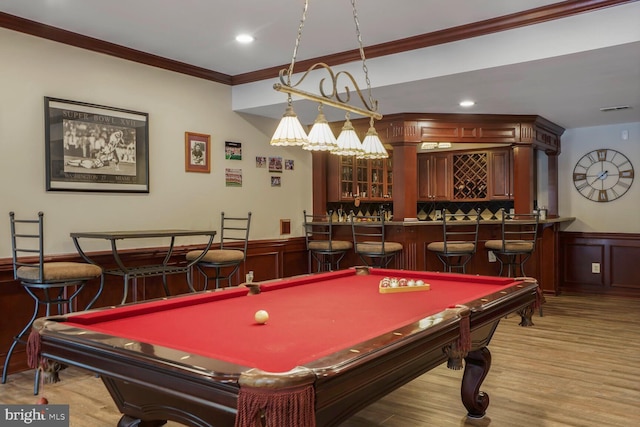 14401 Chalfont Dr, Haymarket, VA 20169 - playroom with wet bar, crown molding, wainscoting, pool table, and wood finished floors