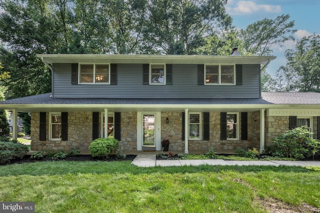 561 Nottingham Dr, Yardley, PA 19067 - view of front of home featuring covered porch, stone siding, a front lawn, a chimney, and a shingled roof