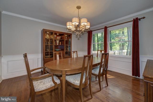 561 Nottingham Dr, Yardley, PA 19067 - dining room with a chandelier, wood-type flooring, a wainscoted wall, ornamental molding, and a decorative wall