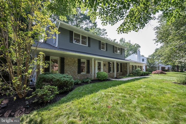 561 Nottingham Dr, Yardley, PA 19067 - view of front of house featuring a front lawn, stone siding, and a porch