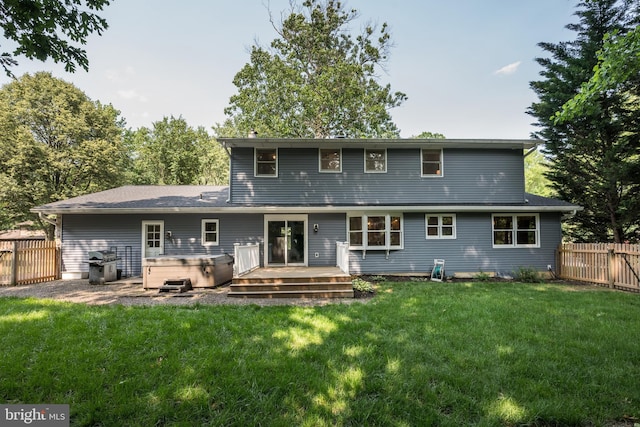 561 Nottingham Dr, Yardley, PA 19067 - rear view of property with a hot tub, a fenced backyard, and a wooden deck