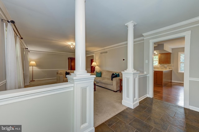 561 Nottingham Dr, Yardley, PA 19067 - hallway with ornate columns, stone tile flooring, and ornamental molding