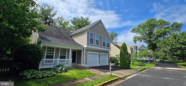 322 Deerpath Ave SW, Leesburg, VA 20175 - view of front facade with covered porch, asphalt driveway, and a garage