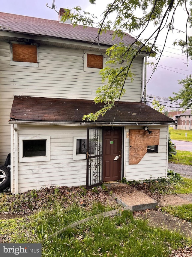 518 Ingleside Ave, Baltimore, MD 21228 - view of front facade with a shingled roof and a chimney