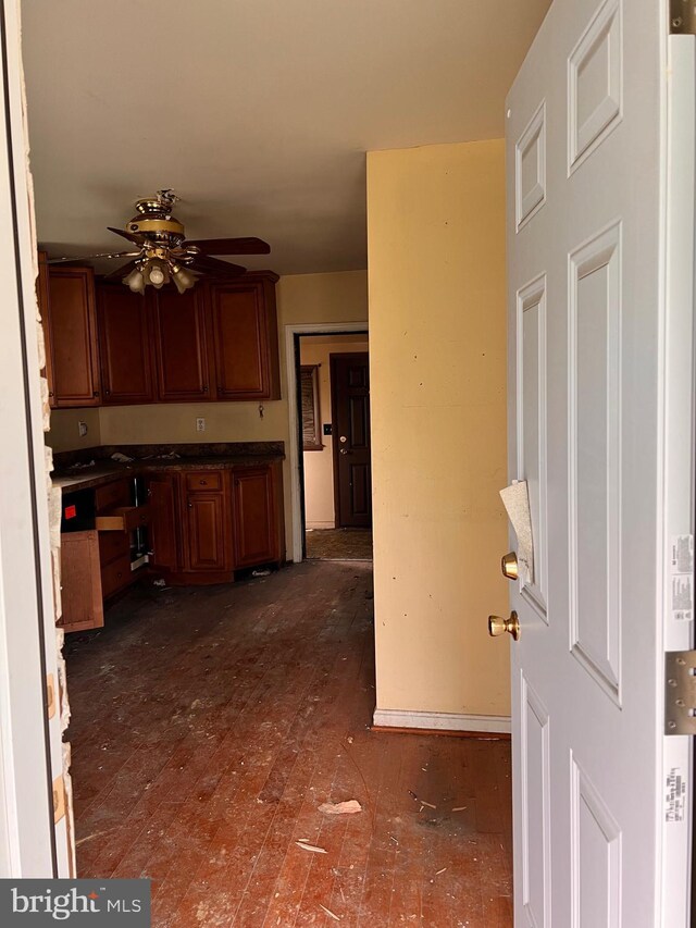 518 Ingleside Ave, Baltimore, MD 21228 - kitchen featuring a ceiling fan, dark countertops, and brown cabinets