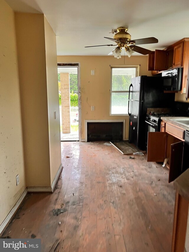 518 Ingleside Ave, Baltimore, MD 21228 - kitchen featuring hardwood / wood-style floors, a ceiling fan, and brown cabinetry
