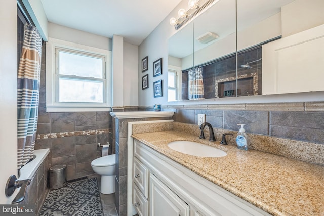 487 College Blvd, Wenonah, NJ 08090 - bathroom featuring tile walls, healthy amount of natural light, vanity, tiled shower / bath combo, and tile patterned flooring