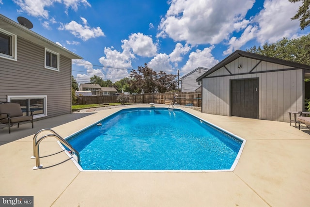 487 College Blvd, Wenonah, NJ 08090 - view of swimming pool featuring a patio, a fenced backyard, and an outbuilding