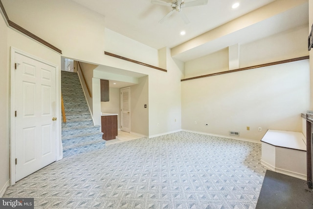 205 Dylan Dr Unit 54, Lansdale, PA 19446 - spare room featuring light carpet, recessed lighting, a ceiling fan, stairs, and a high ceiling