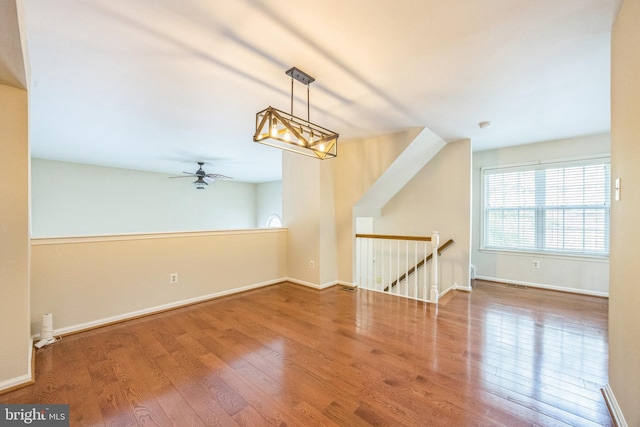 205 Dylan Dr Unit 54, Lansdale, PA 19446 - spare room featuring wood finished floors, a ceiling fan, and a chandelier