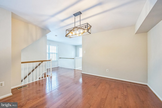 205 Dylan Dr Unit 54, Lansdale, PA 19446 - empty room with wood finished floors and a chandelier