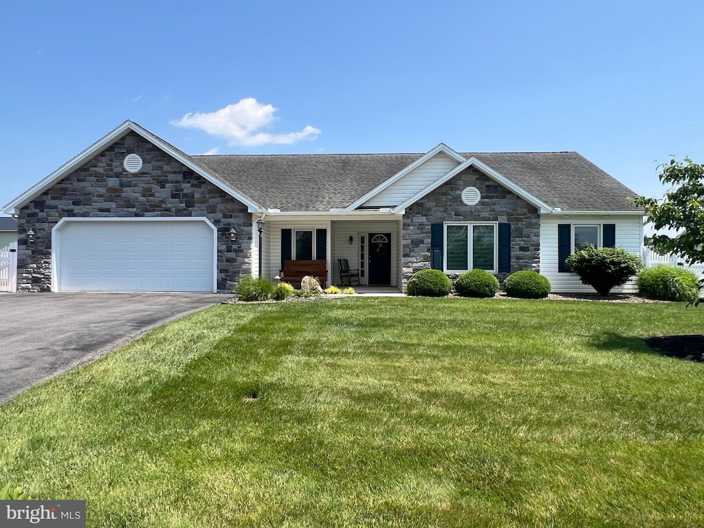 123 Quentin Cir Unit 9, Shippensburg, PA 17257 - single story home with stone siding, driveway, an attached garage, a front yard, and a shingled roof