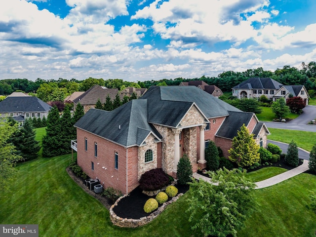 1720 Adeline Dr, Mechanicsburg, PA 17050 - view of front of home with stone siding, a front yard, and a residential view