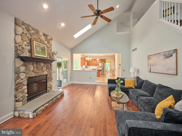 21 Shara Ln, Pennington, NJ 08534 - living area featuring high vaulted ceiling, ceiling fan, hardwood / wood-style floors, a fireplace, and a chandelier