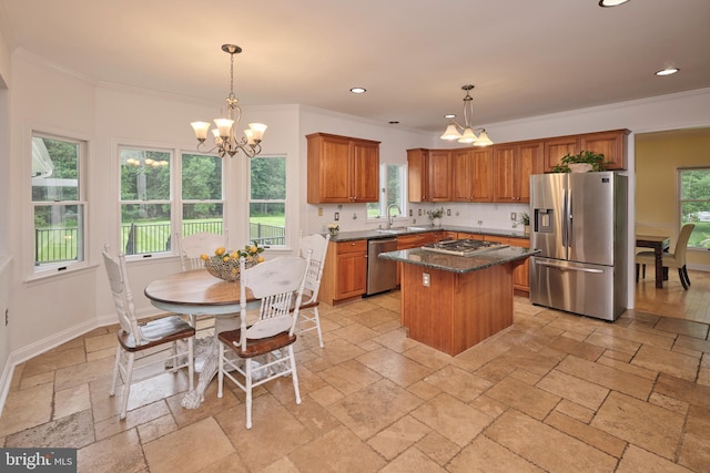21 Shara Ln, Pennington, NJ 08534 - kitchen featuring stainless steel appliances, a chandelier, stone tile flooring, ornamental molding, and brown cabinetry