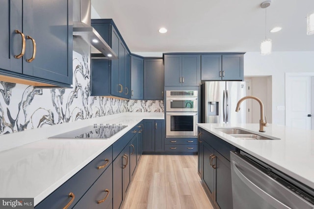 20769 Partlows Store Sq, Ashburn, VA 20147 - kitchen with appliances with stainless steel finishes, light countertops, wall chimney range hood, light wood-style flooring, and recessed lighting