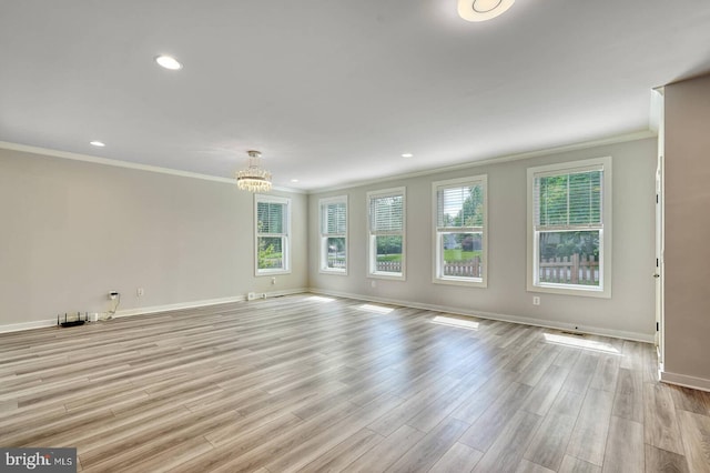 20769 Partlows Store Sq, Ashburn, VA 20147 - spare room featuring crown molding, light wood finished floors, a chandelier, and recessed lighting