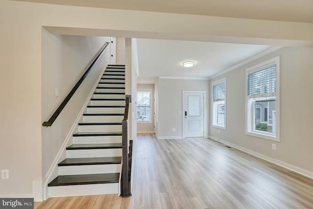 20769 Partlows Store Sq, Ashburn, VA 20147 - entrance foyer with ornamental molding, stairway, and wood finished floors
