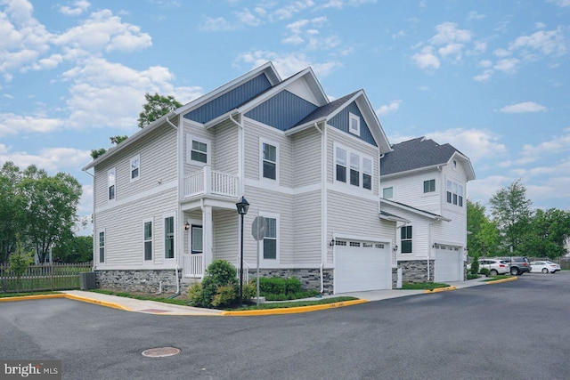 20769 Partlows Store Sq, Ashburn, VA 20147 - view of home's exterior featuring stone siding, an attached garage, and board and batten siding