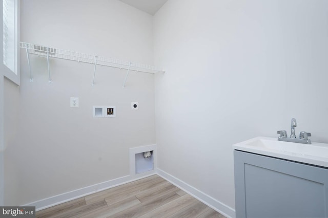 20769 Partlows Store Sq, Ashburn, VA 20147 - laundry room with electric dryer hookup, hookup for a washing machine, and light wood-type flooring
