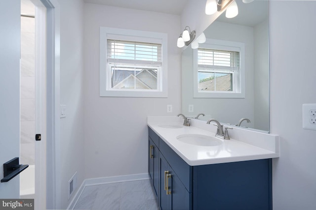 20769 Partlows Store Sq, Ashburn, VA 20147 - bathroom featuring double vanity and marble finish floors